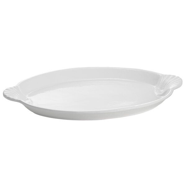 A white cast aluminum oval platter with a shell design handle.