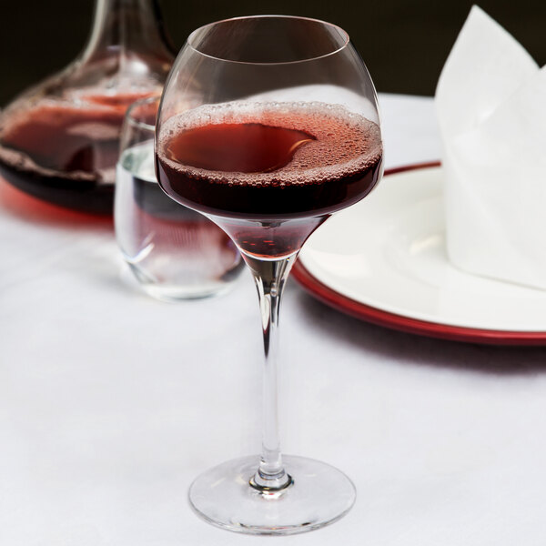 A close-up of a Chef & Sommelier Tannic wine glass full of red wine.