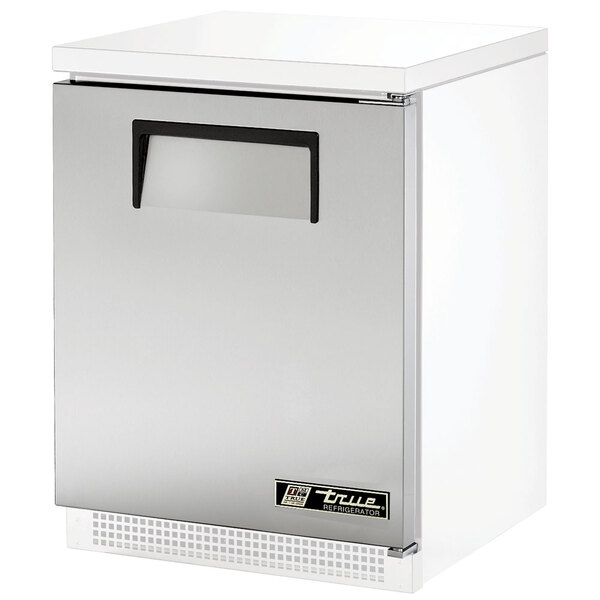 The True steel right hinged door assembly with a recessed handle on a white refrigerator.