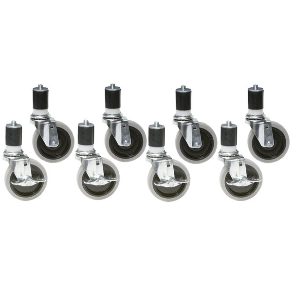 A group of 5" zinc work table casters with black rubber wheels.