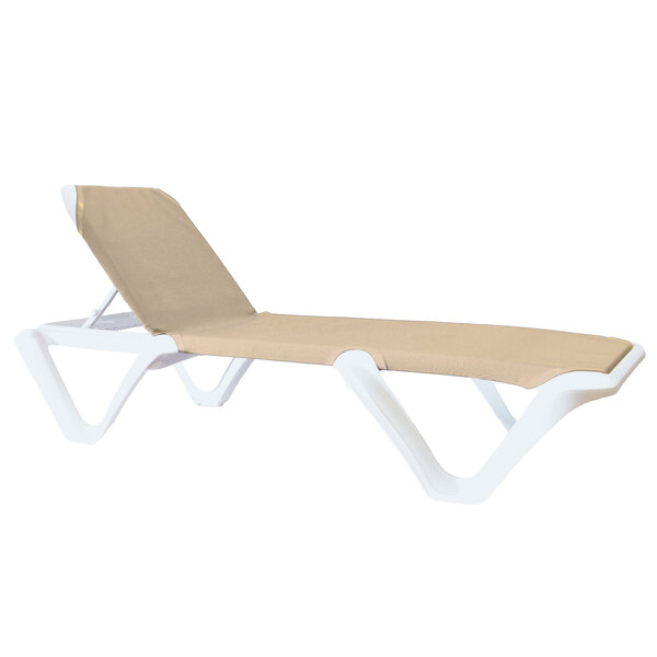 A white and tan Grosfillex Nautical sling chaise lounge chair.