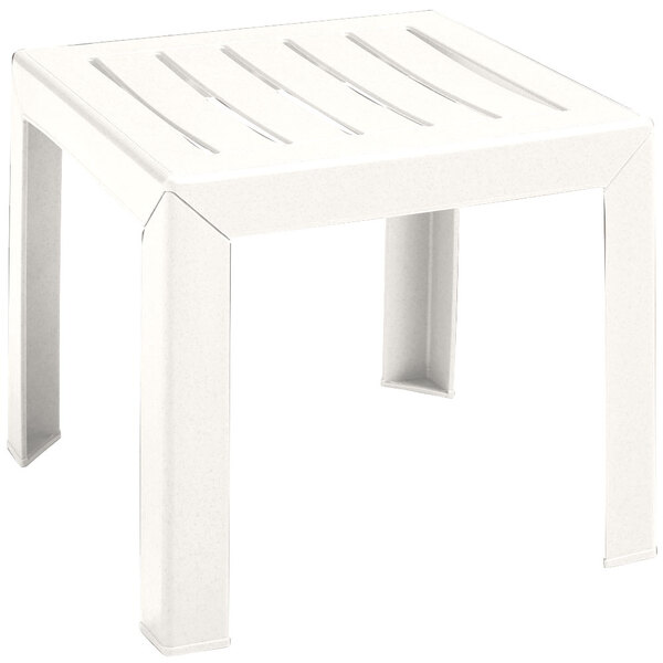A white plastic Grosfillex low table with legs.