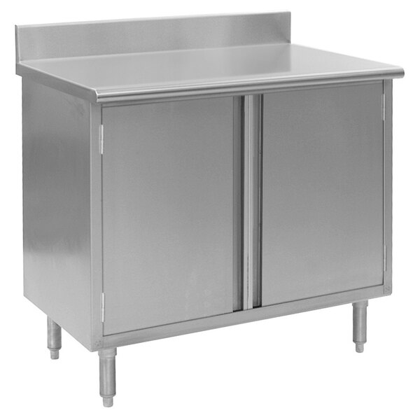 A stainless steel Eagle Group work table with cabinet base and backsplash.