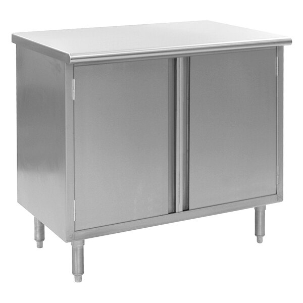 A stainless steel cabinet with two doors below a white surface.