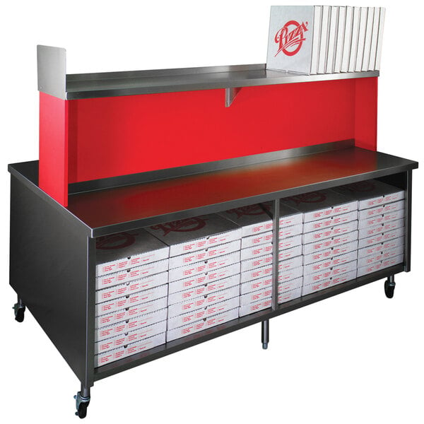 A red Eagle Group pizza table with black shelves holding pizza boxes.