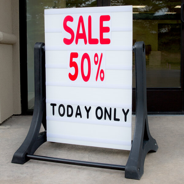 A white Aarco Rocker letterboard sign on a stand with red text that says "Sale 50% Today Only"