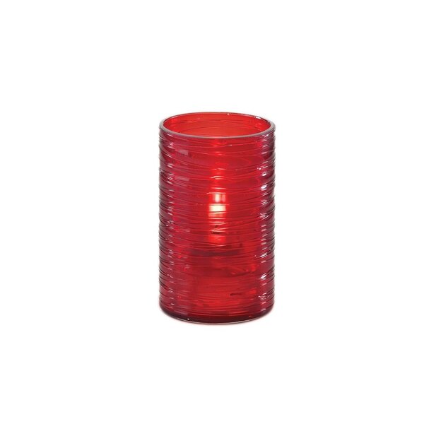 A Sterno red glass liquid candle holder with a light inside.