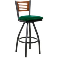 BFM Seating Espy Sand Black Metal Bar Height Chair with Cherry Wooden Back and 2" Green Vinyl Swivel Seat