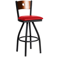 BFM Seating Darby Sand Black Metal Bar Height Chair with Cherry Wooden Back and 2" Red Vinyl Swivel Seat