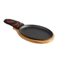Choice 9 1/4" x 7" Oval Pre-Seasoned Cast Iron Fajita Skillet with Natural Finish Wood Underliner and Chili Pepper Cotton Handle Cover