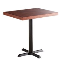 Lancaster Table & Seating 24" x 30" Standard Height Wood Butcher Block Table with Mahogany Finish and Cast Iron Cross Base Plate