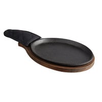 Choice 9 1/4" x 7" Oval Pre-Seasoned Cast Iron Fajita Skillet with Oak Finish Wood Underliner and Black Cotton Handle Cover