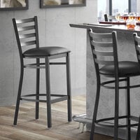 Lancaster Table & Seating Black Finish Ladder Back Bar Stool with 2 1/2 inch Black Vinyl Padded Seat - Detached
