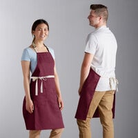 Choice Burgundy Poly-Cotton Adjustable Bib Apron with 2 Pockets and Natural Webbing Accents - 32" x 30"