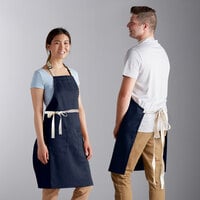 Choice Navy Blue Poly-Cotton Adjustable Bib Apron with 2 Pockets and Natural Webbing Accents - 32" x 30"