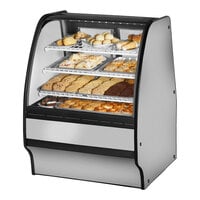 True TGM-DC-36-SC/SC-S-W 36 1/4" Curved Glass Stainless Steel Dry Bakery Display Case with White Interior