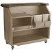 A brown portable bar cart with a black top and a shelf.