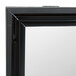 A close up of a True black door assembly with a mirror on it.