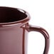 A brown GET SAN plastic coffee mug with a handle.