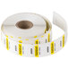 A roll of white National Checking Company Tuesday food labeling stickers with yellow and black text.