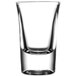 An Arcoroc tall shot glass on a white background.