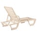 A tan resin chaise lounge chair with a white background.