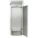 A silver Traulsen roll-thru refrigerator with a solid door open.