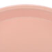 A close-up of a pink tray with a white background.