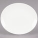 A Tuxton Venice eggshell oval coupe china platter on a white background.