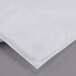 A folded Oxford T200 Superblend white pillow case.