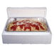 A white Polar Tech insulated shipping box with a clear container of spaghetti inside.
