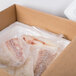 A Polar Tech insulated shipping box with fish in plastic bags.