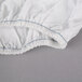 A white Oxford T300 full size fitted sheet with blue stitching.