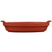 A red Tablecraft copper cast aluminum oval casserole dish with a handle.