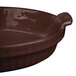 A brown Tablecraft shallow oval casserole dish with a handle.