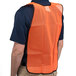 A man wearing a Cordova orange high visibility safety vest.