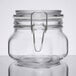 A close-up of a Libbey clear glass jar with a metal ring.