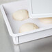 An American Metalcraft white ABS plastic dough box filled with dough balls.