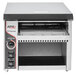 A black and silver APW Wyott conveyor toaster on a counter in a professional kitchen.