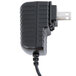 An Edlund black 12V AC adapter with a cord attached.