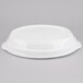 A white Tablecraft cast aluminum oval casserole dish with a white plastic lid.