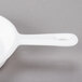 A white Tablecraft cast aluminum fry pan with a handle on a gray surface.
