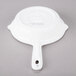 A white Tablecraft cast aluminum fry pan with a handle.