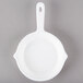 A white round Tablecraft fry pan with a handle.