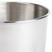 A close up of a stainless steel Hamilton Beach malt cup with a handle.