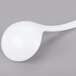 A Tablecraft white cast aluminum long ladle with a white handle on a gray surface.