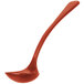 A red ladle with a long handle.