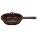 A brown Tablecraft cast aluminum fry pan with a handle.