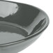 A gray cast aluminum fry pan with an open handle.