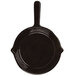 A black skillet with a handle.